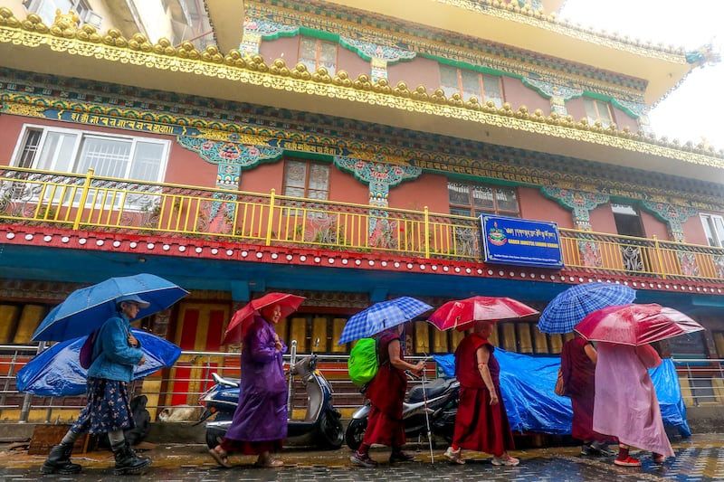 Tibetan nuns and monks walk in Dharamsala July 1, 2025.
