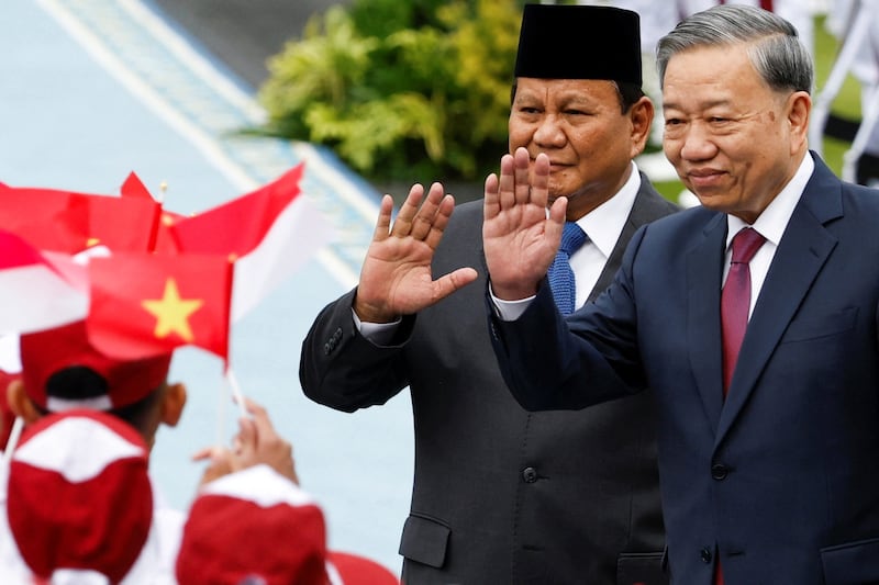 Indonesian President Prabowo Subianto (L) and Vietnam's Communist Party General Secretary To Lam inspect the guard of honor, during a welcoming ceremony, on the day of their meeting, at the Merdeka Palace in Jakarta, Indonesia, March 10, 2025.